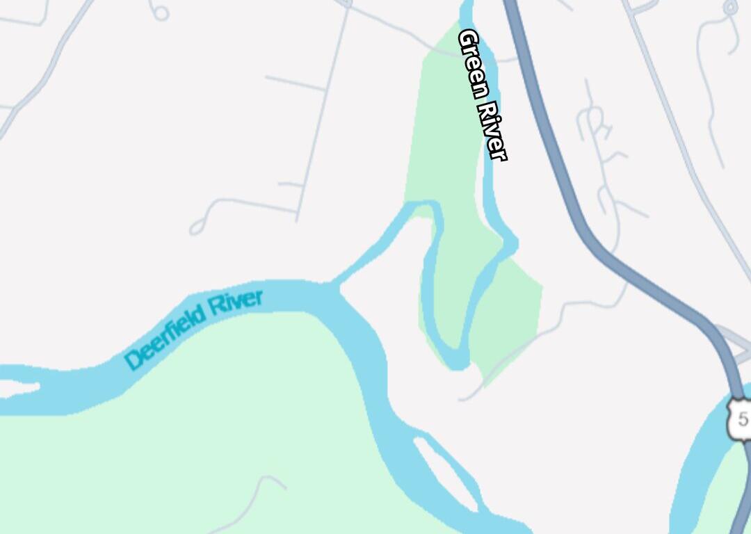 Map indicating the discharge location near Meridian St along the Green River, with the Deerfield River nearby; bottom banner reads 'Sanitary Sewer Overflow Alert' May 17, 2026 (City of Greenfield).