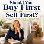 Woman sits at a table with a laptop and notebook in a bright home office; large 'Should You Buy First or Sell First?' text overlay and a 'FOR SALE' sign in the background.